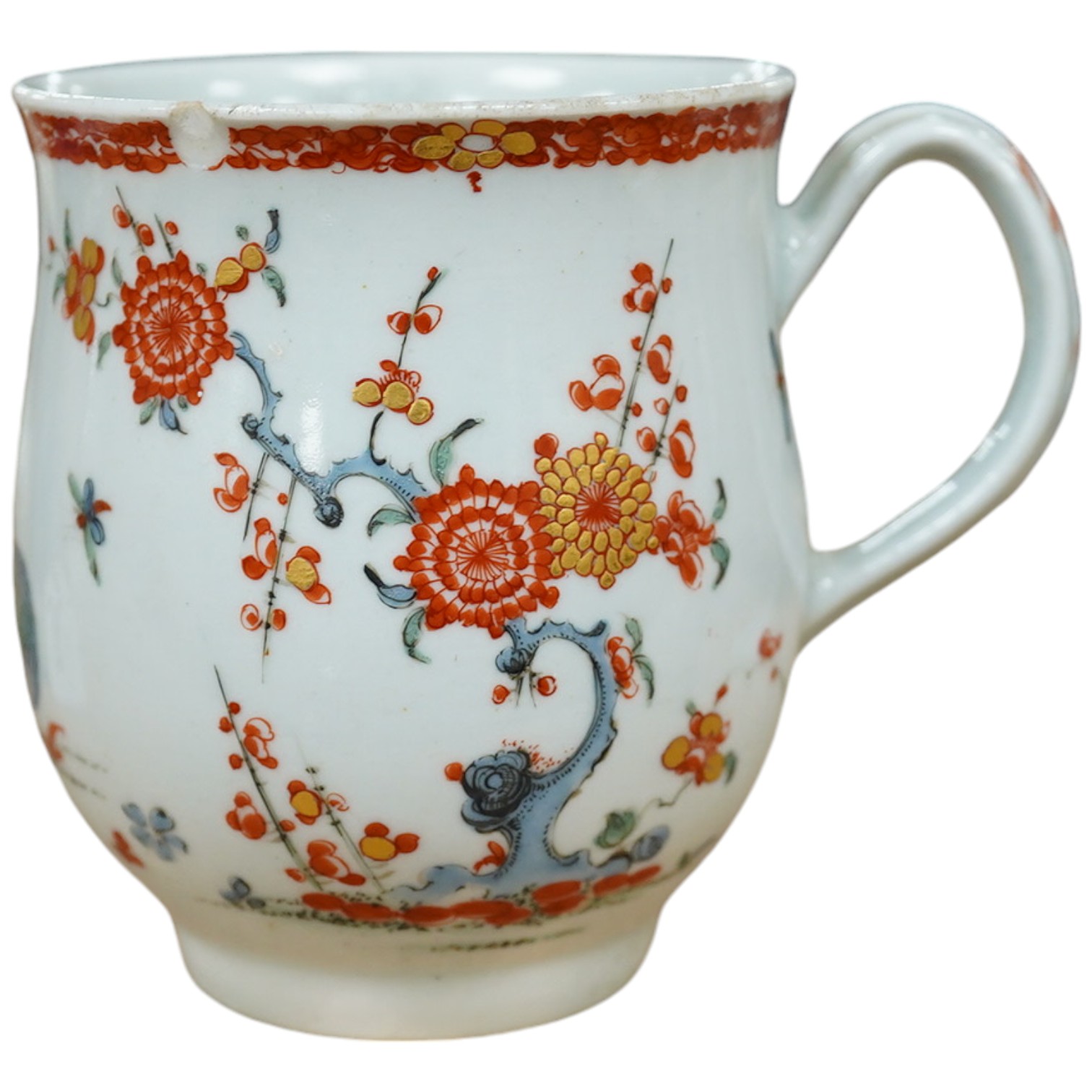 An 18th century Worcester polychrome porcelain mug decorated with quails, 9cm high. Condition - fair, chip to top rim